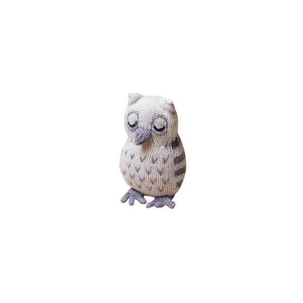 Knitted owl toy on a white background