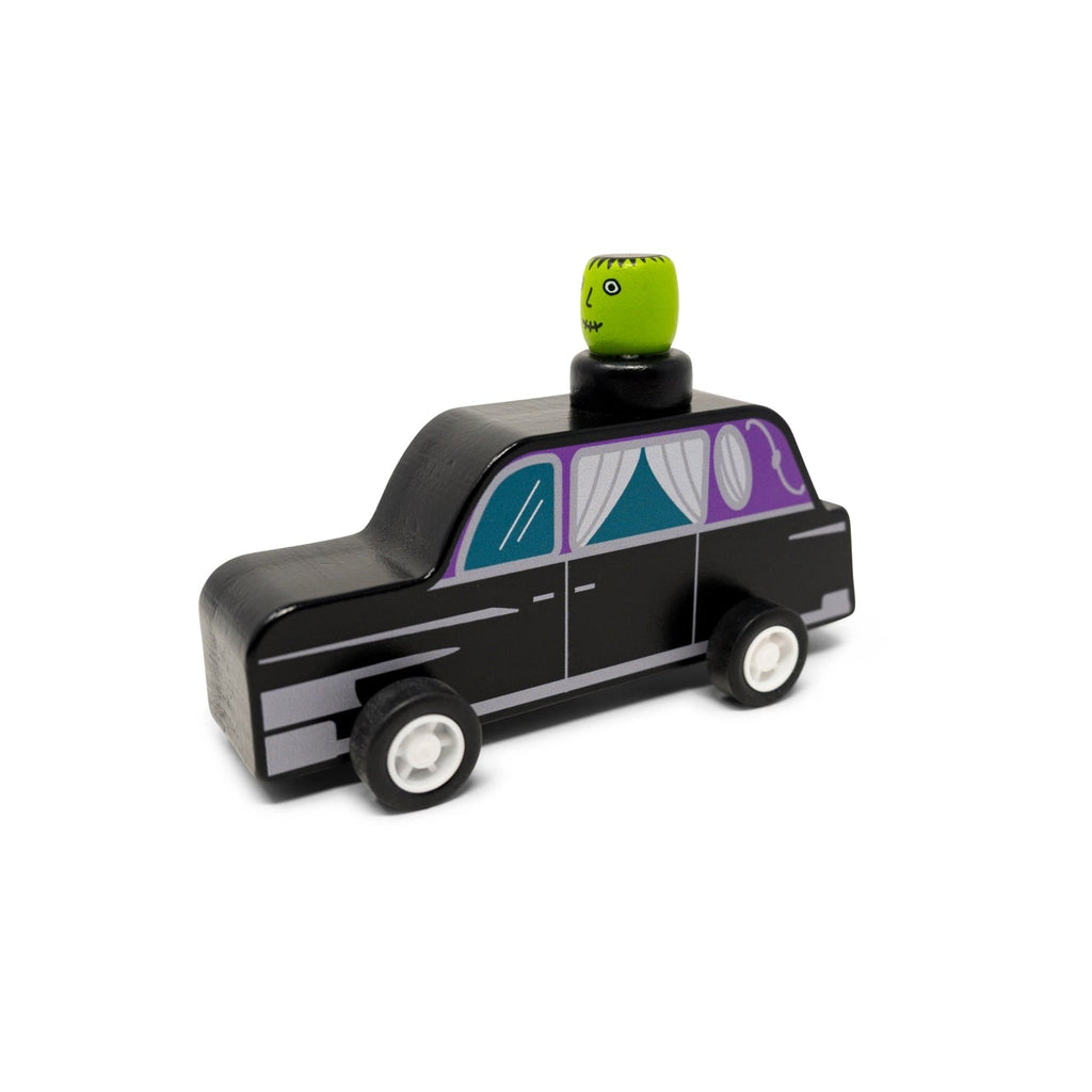 Toy hearse with a Frankenstein on top against a white background